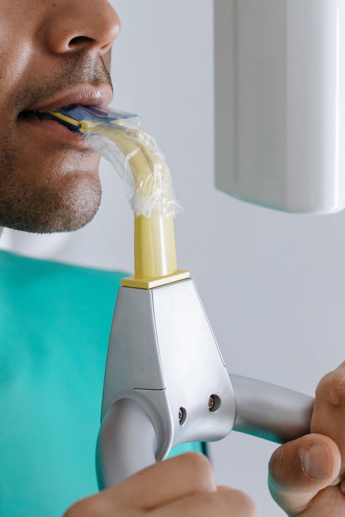 Detailed image showing a dental x-ray procedure in progress, highlighting modern oral health care.